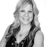 a black and white photo of a woman posing for a photo